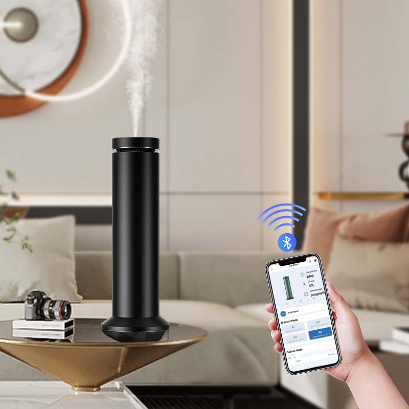 Black scent diffuser and Bluetooth app in a lounge setting